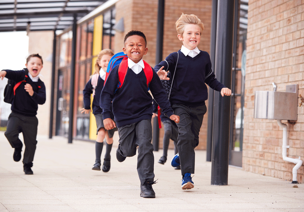 primary students in playground  loading=